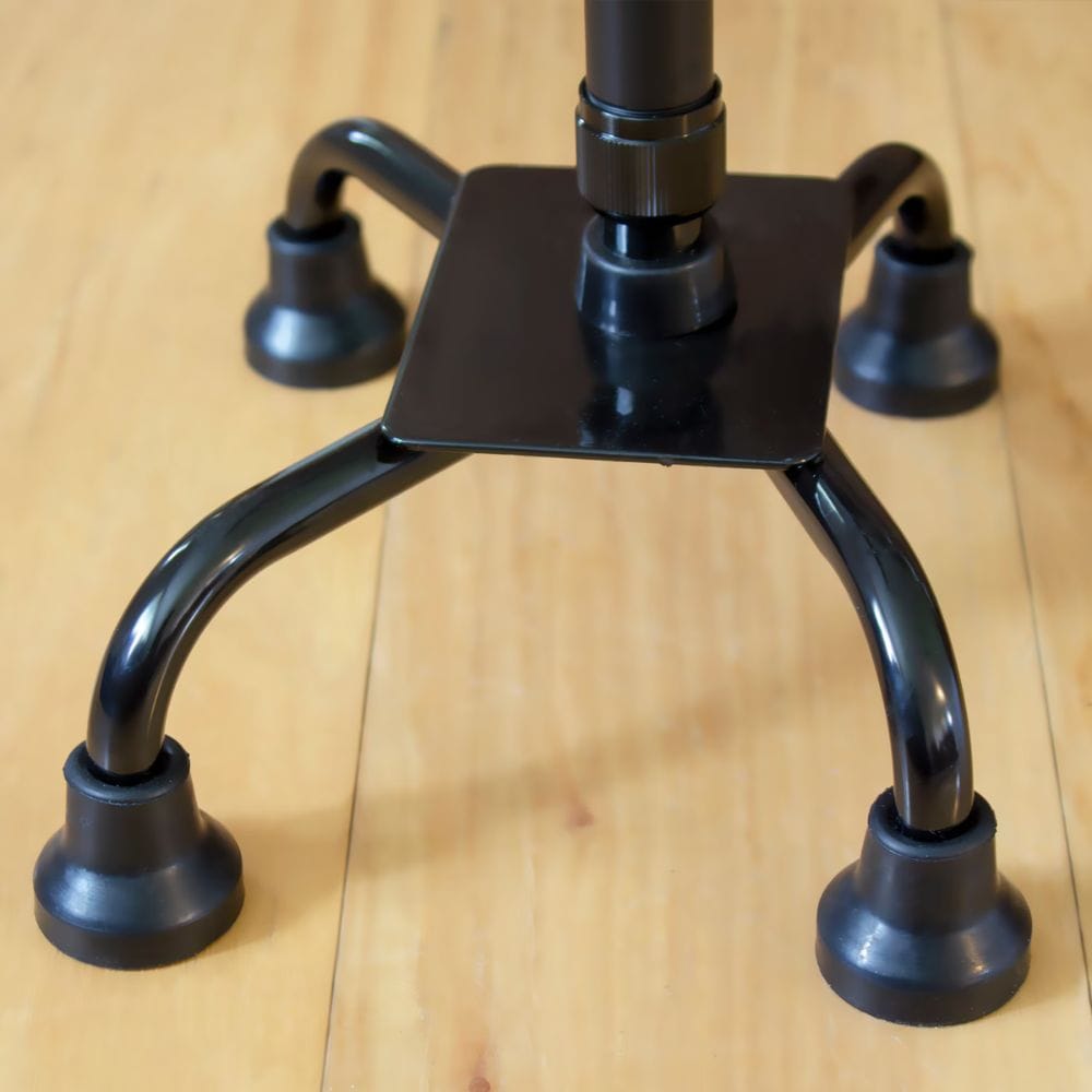 Black metal stand on a wooden surface