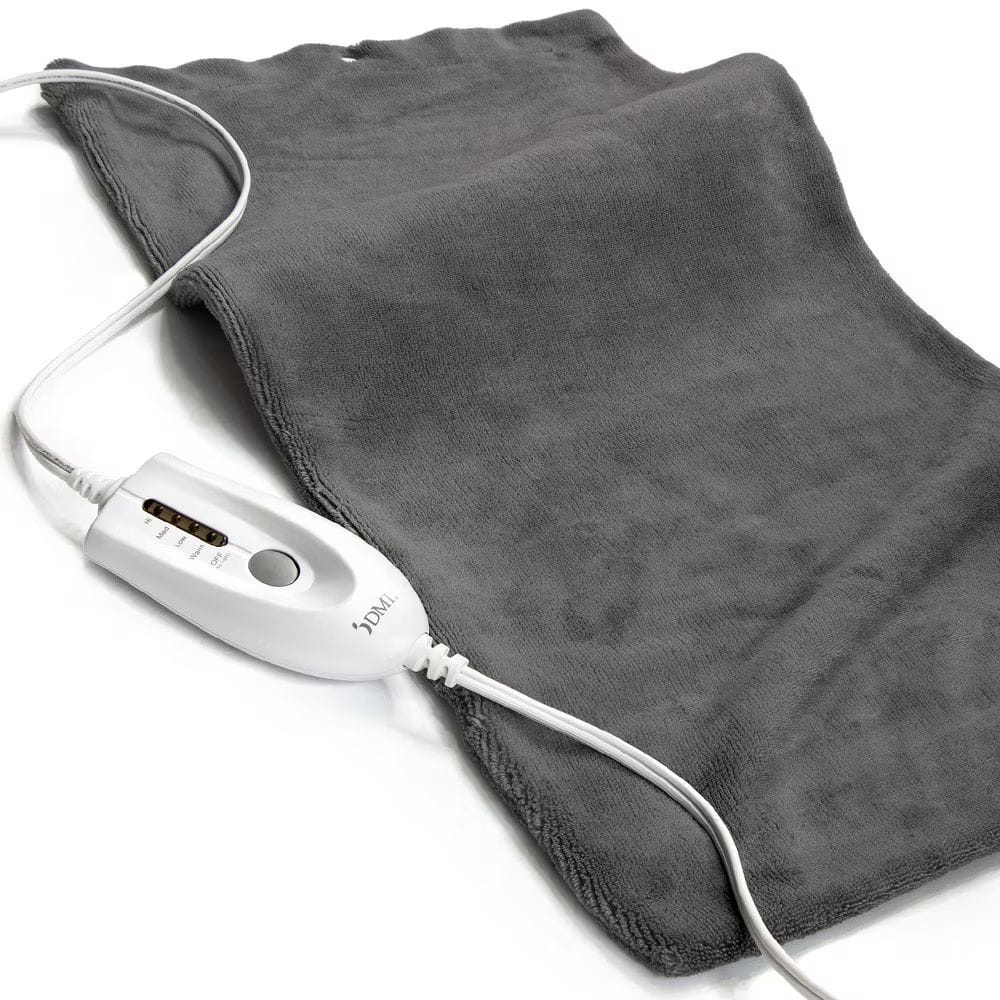 Gray heating pad with digital controller on a white background