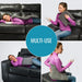 Woman using a heating pad on a black leather couch with 'MULTI-USE' text overlay.
