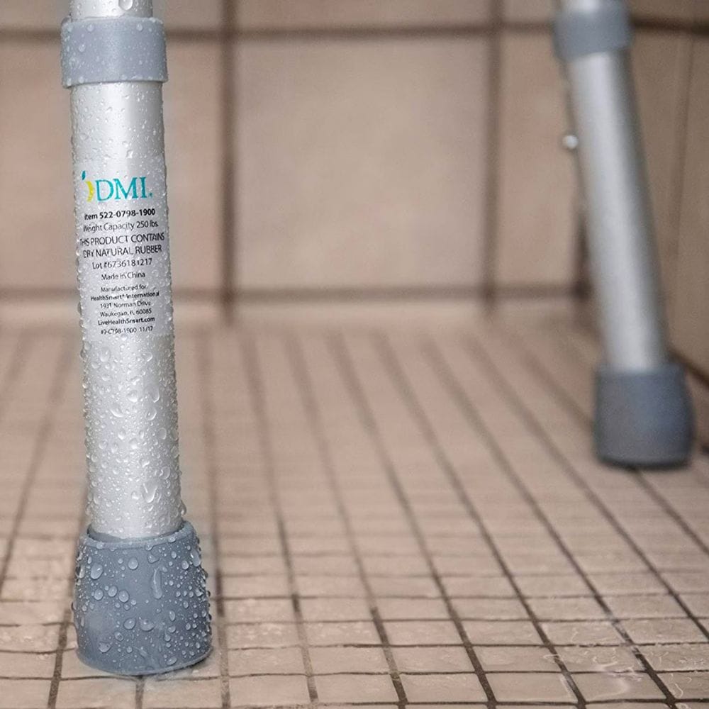 Metallic cylindrical object with 'DML' branding on a tiled floor.