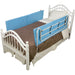Bed with blue safety rail and brown bedding on a white background