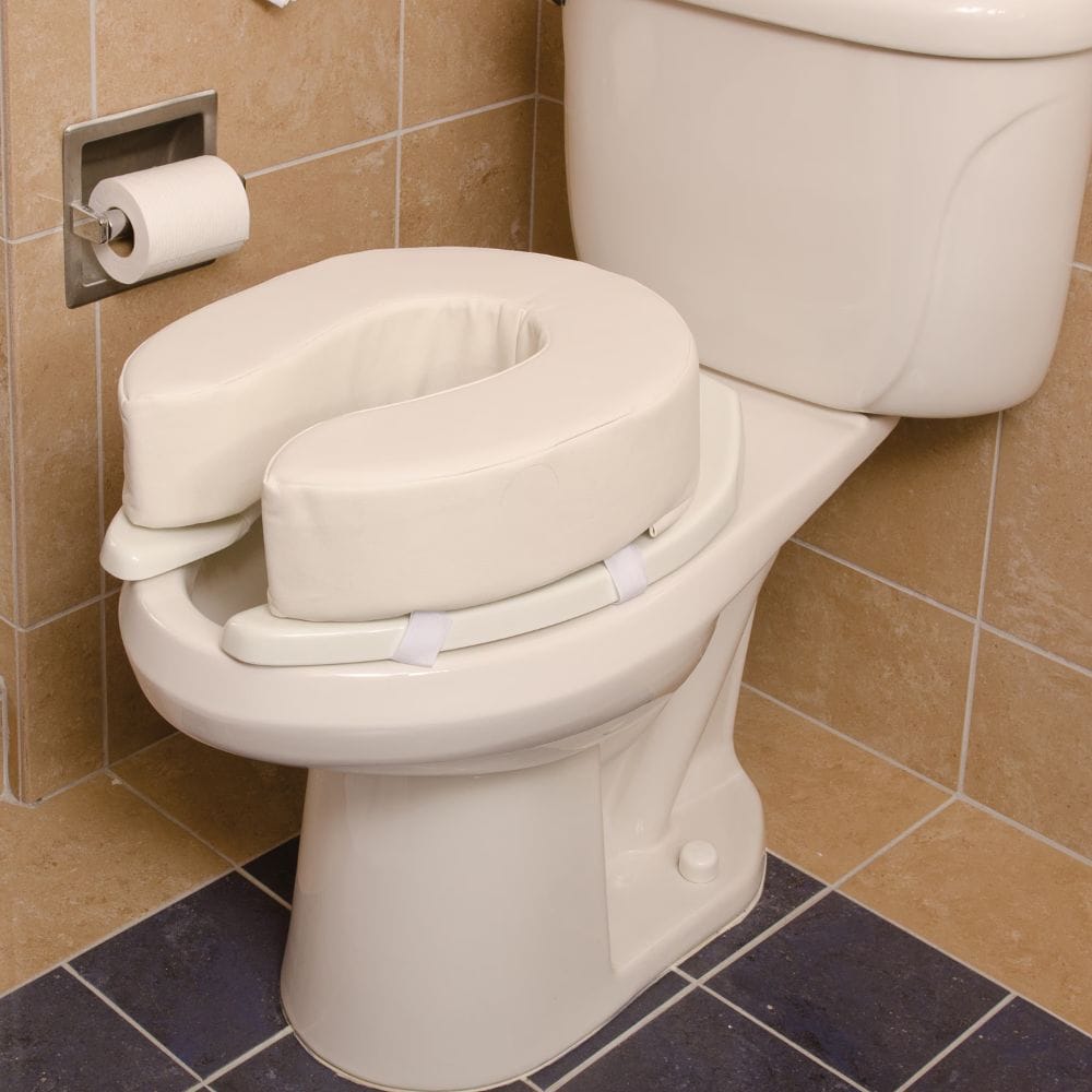 Toilet seat with a raised toilet seat attachment in a bathroom setting.