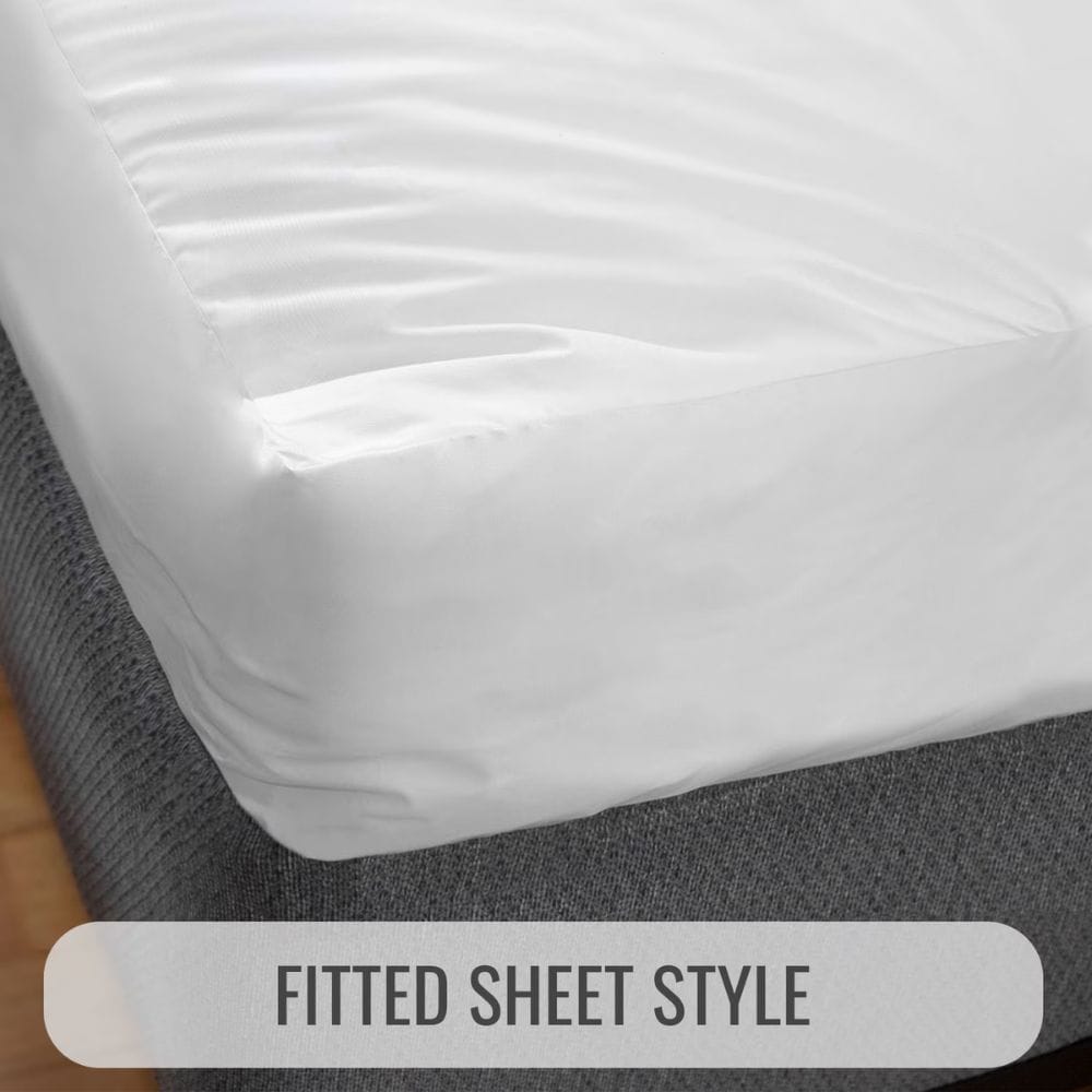 A close-up of a fitted white sheet draped over the corner of a mattress, with a gray textured mattress base visible underneath. A semi-transparent label at the bottom reads 'FITTED SHEET STYLE'.