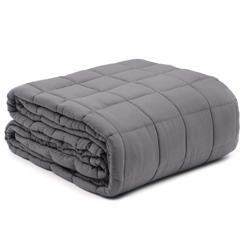 Folded gray weighted blanket on a white background