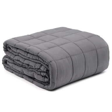 Folded gray weighted blanket on a white background
