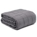Folded gray weighted blanket on a white background