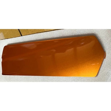 Orange plastic cover on a white surface with a tiled background