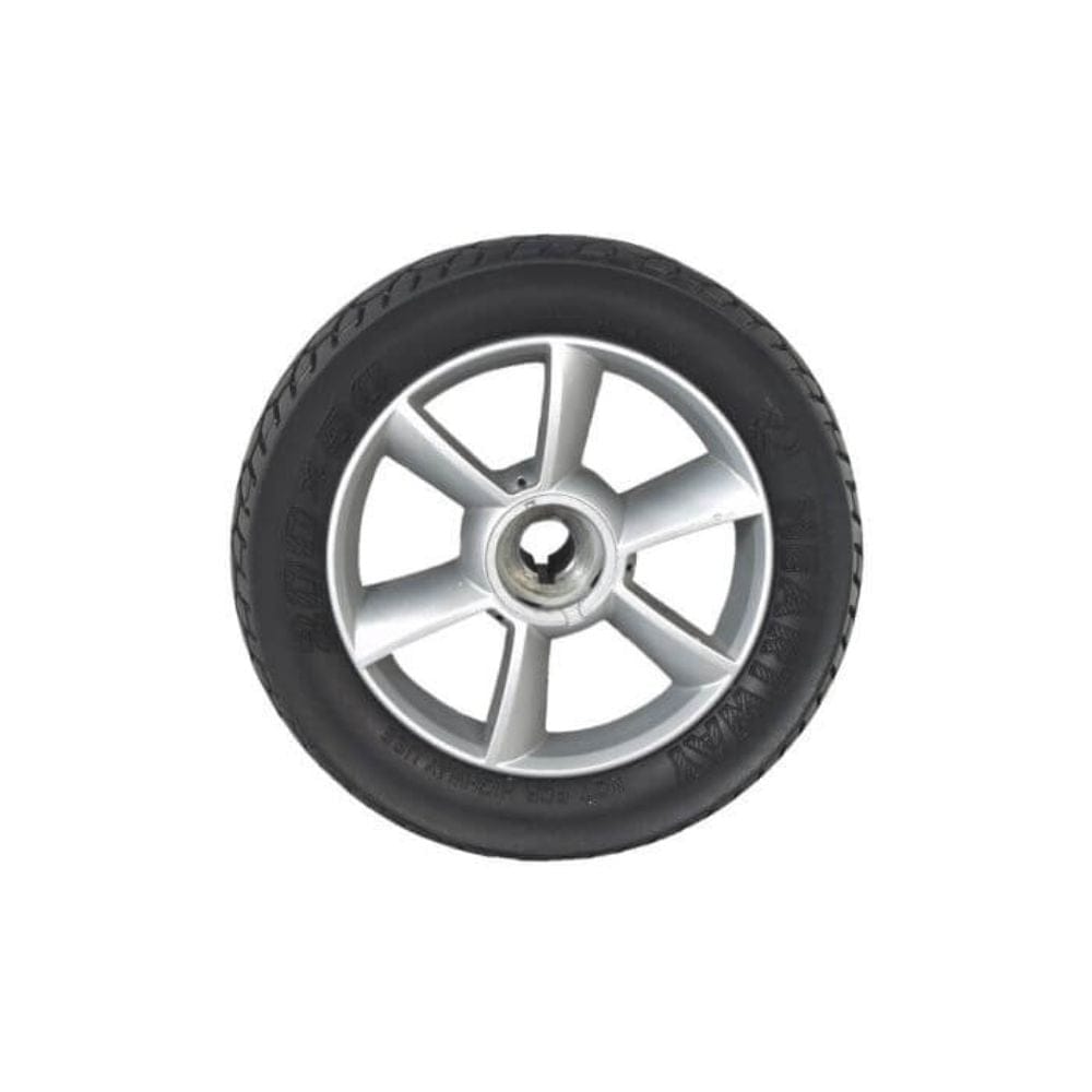 Car tire with alloy rim on a white background
