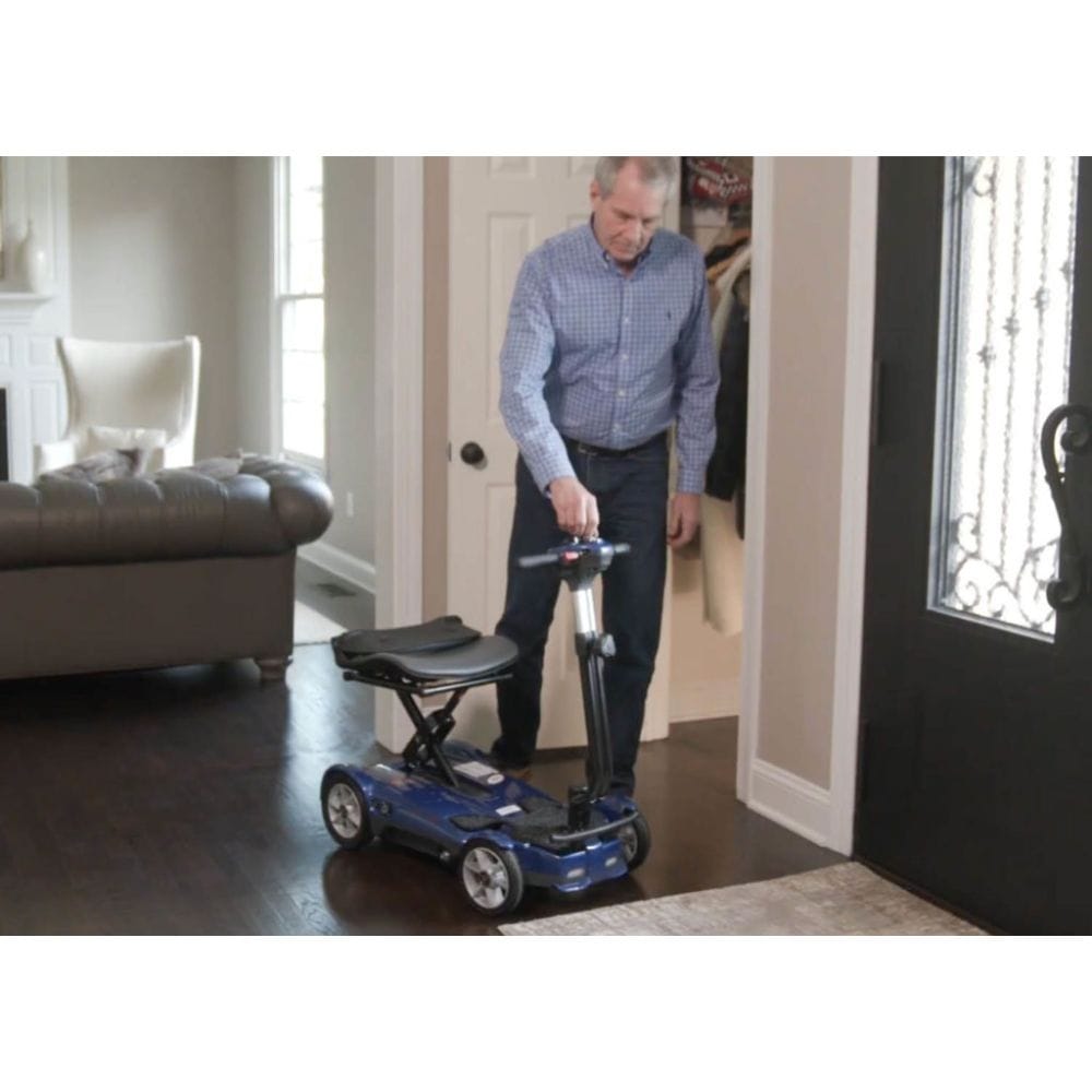 Man using a mobility scooter in a home setting