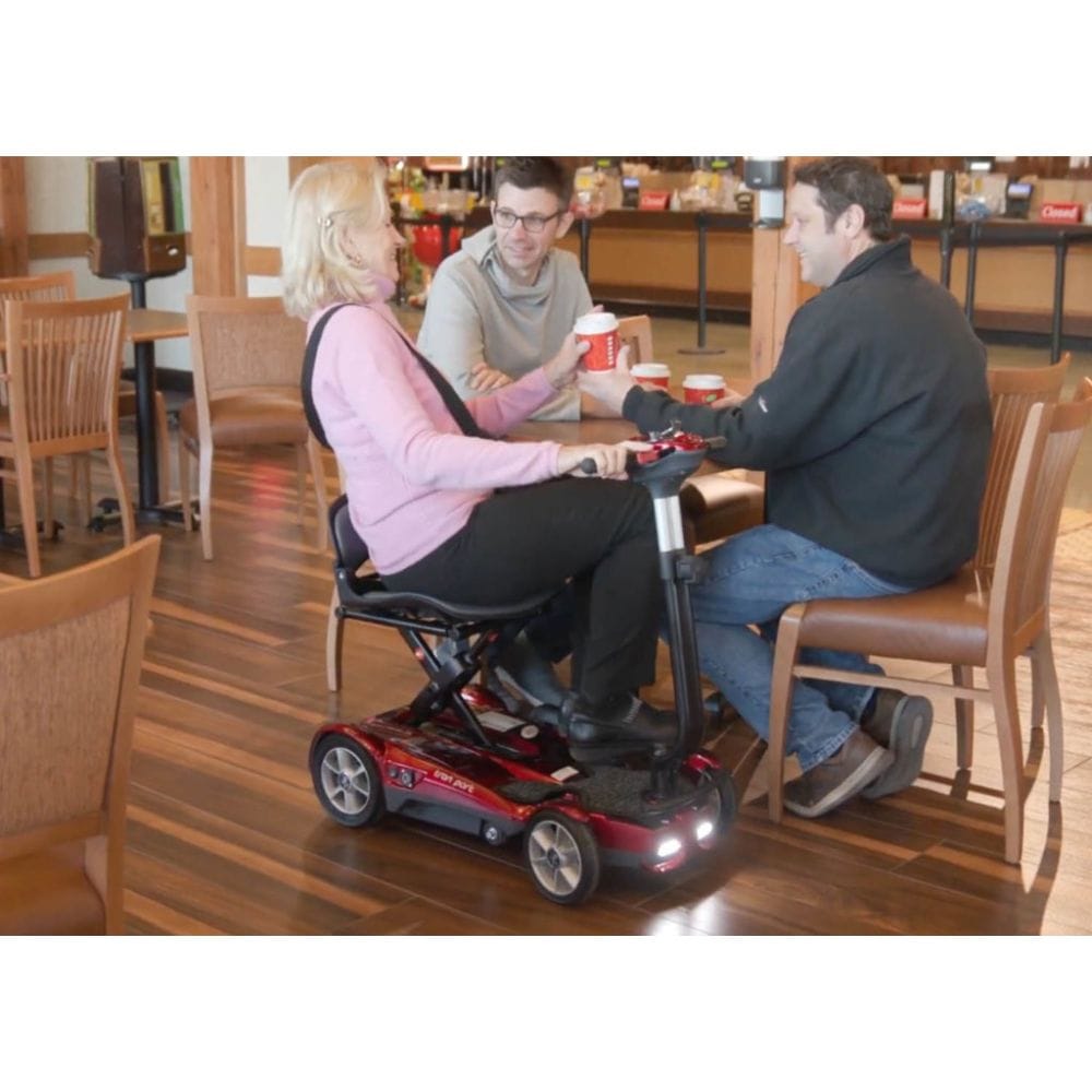 Person using a mobility scooter in a restaurant setting