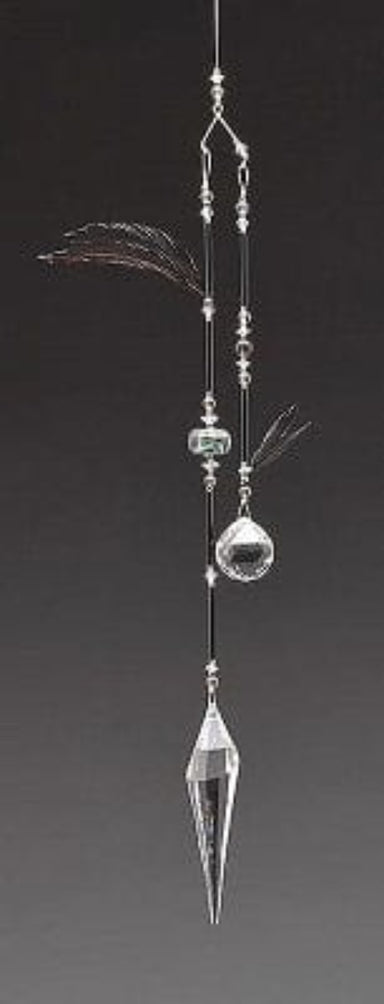 Decorative hanging ornament with crystals and beads on a dark background