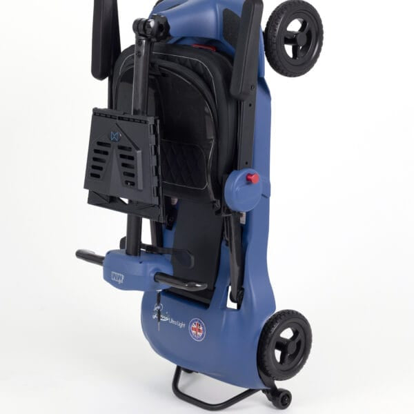Monarch Mobility Genie Ultralight folding mobility scooter folded upright for compact storage