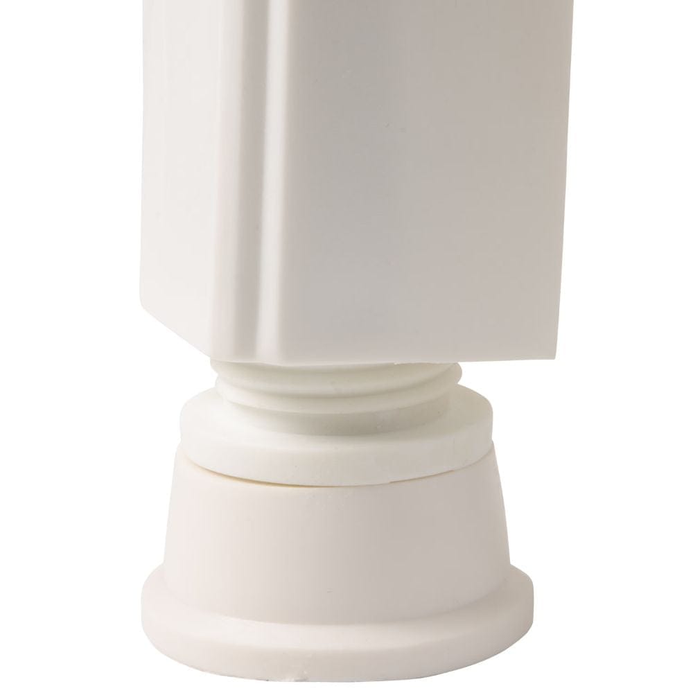 White cylindrical object with a textured surface on a white background