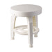 White stool with a circular design on a white background