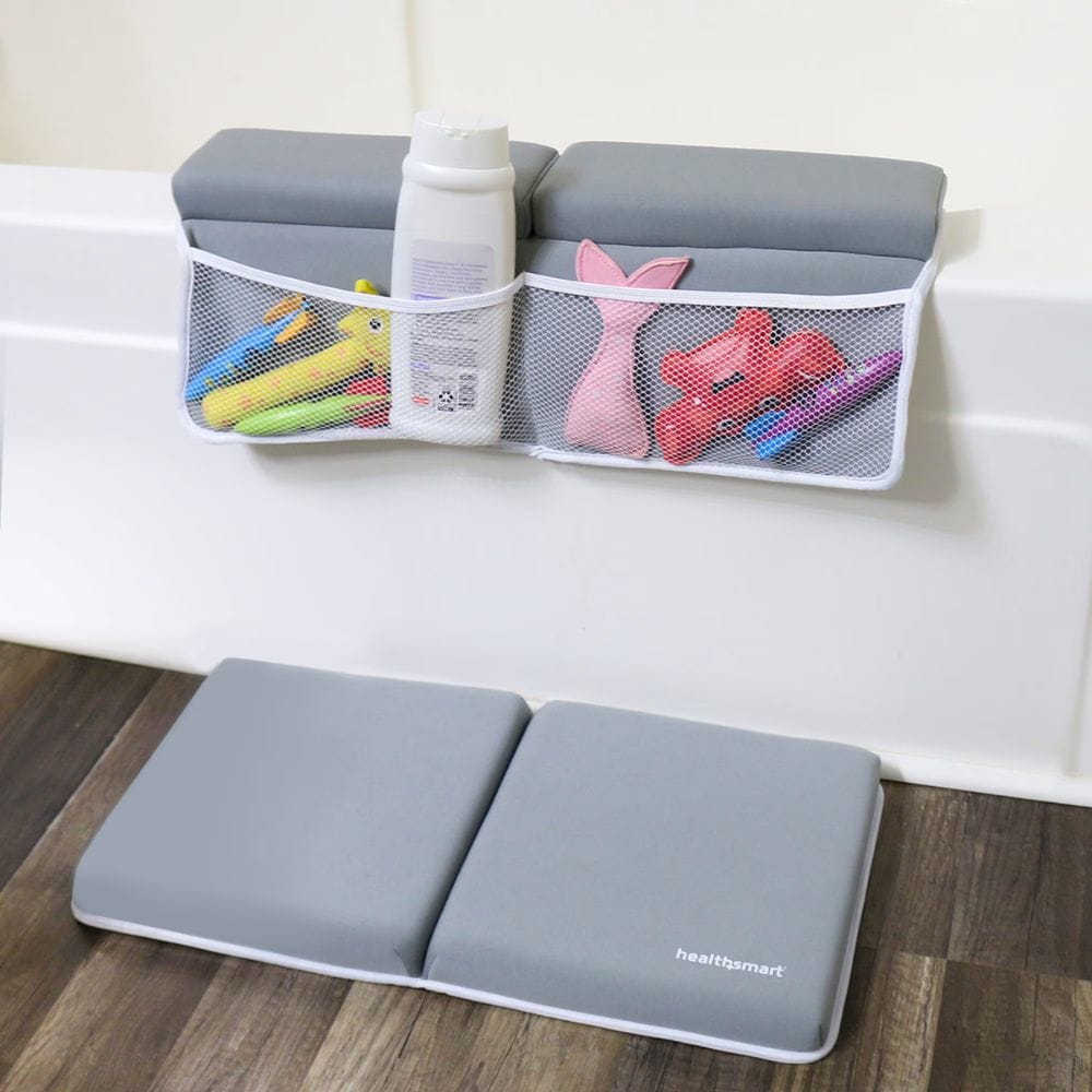 Gray bath seat with storage pockets and toys on a bathtub, featuring the brand 'HealthSmart'.