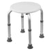 Adjustable height stool with a white seat and metal legs on a white background