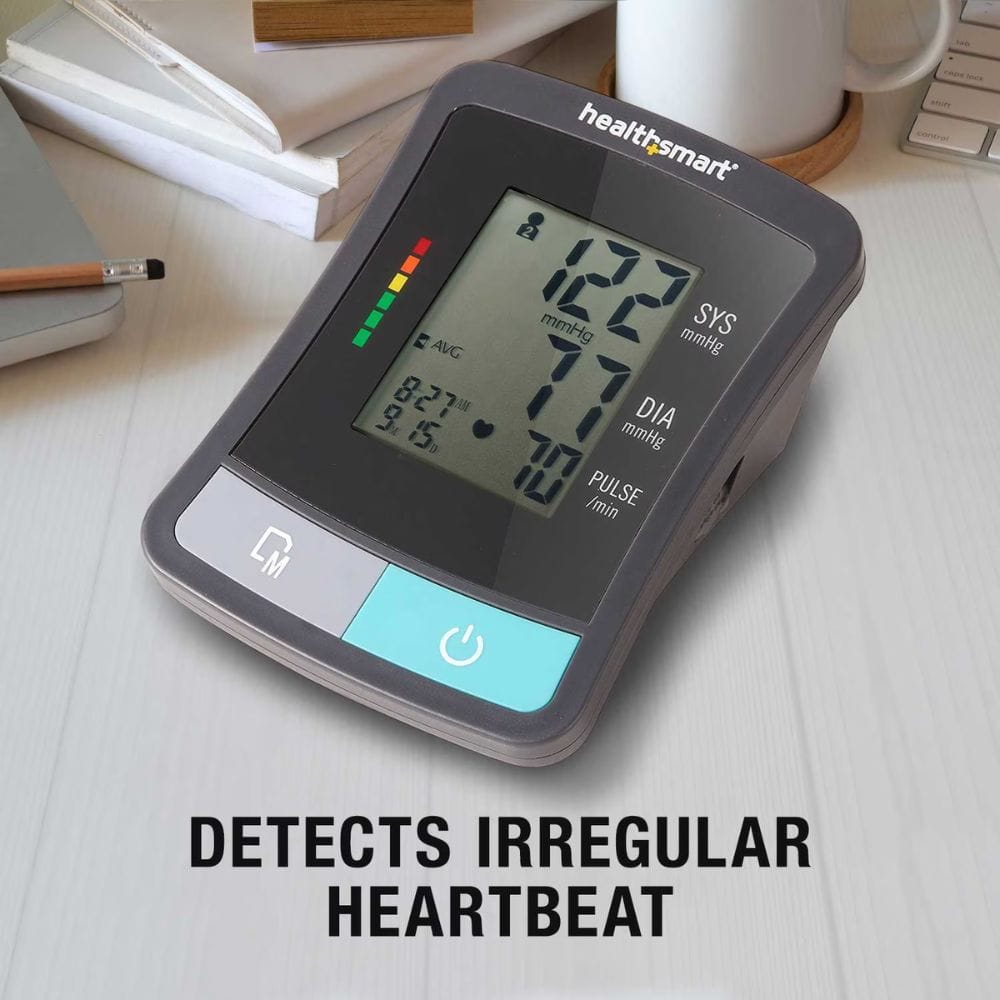 HealthSmart blood pressure monitor on a desk with text indicating it detects irregular heartbeats.