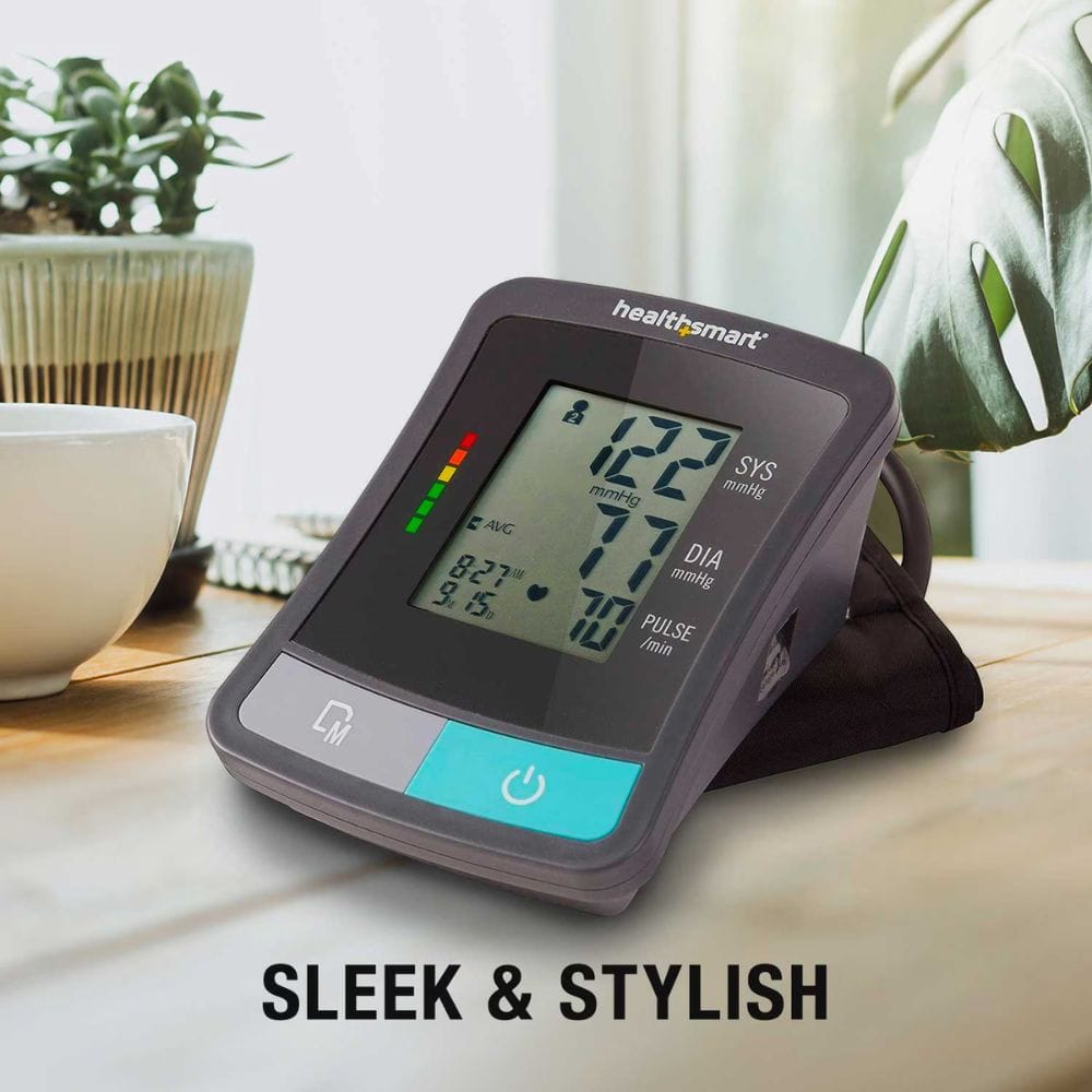 HealthSmart blood pressure monitor on a table with plants in the background