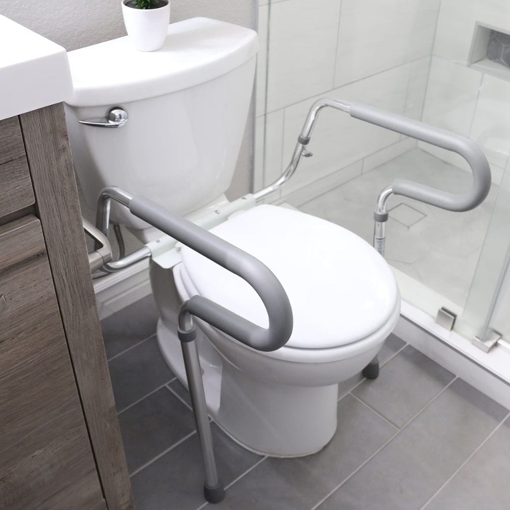 Bathroom setup with a toilet and grab bars for safety