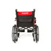 Black wheelchair with red seat cover on a white background