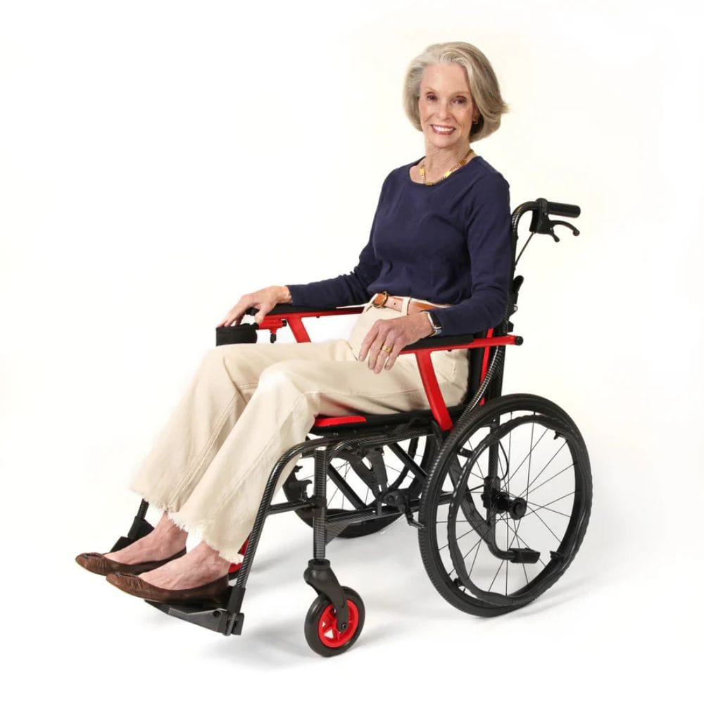 Woman sitting in a wheelchair with red accents on a white background