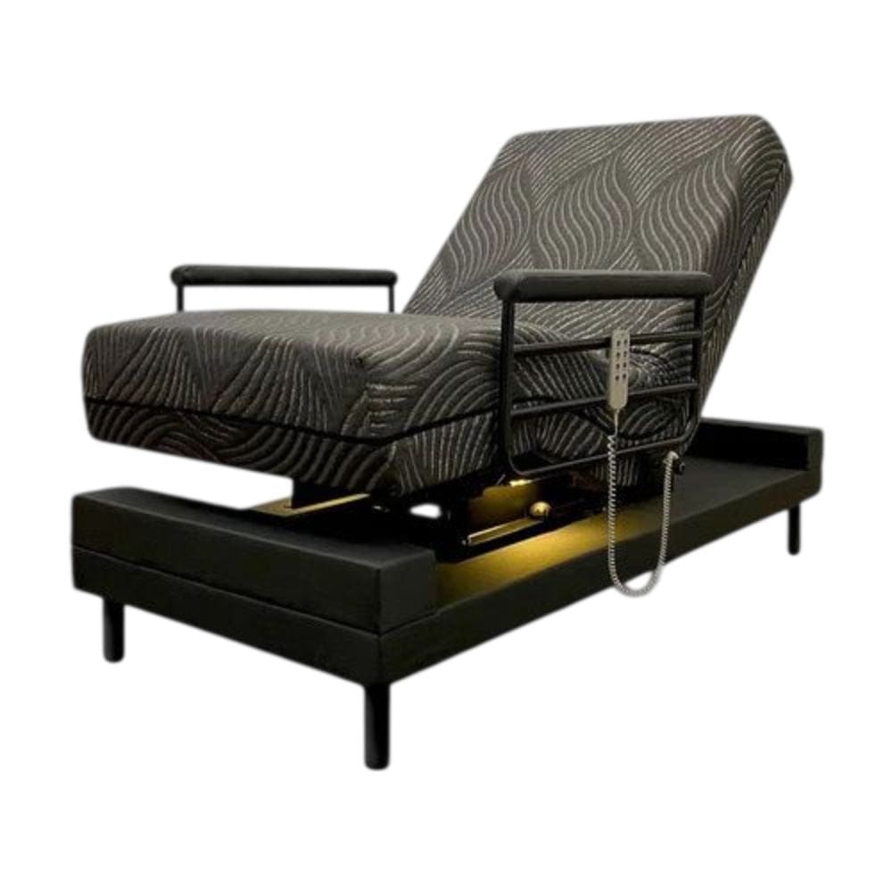 Gray patterned adjustable bed with controls on a white background