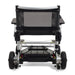 Back view of a black and silver electric wheelchair on a white background