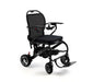 A black electric motorized wheelchair with a mesh backrest, padded seat, armrests, and fold-out footrest, photographed on a clean white studio background.
