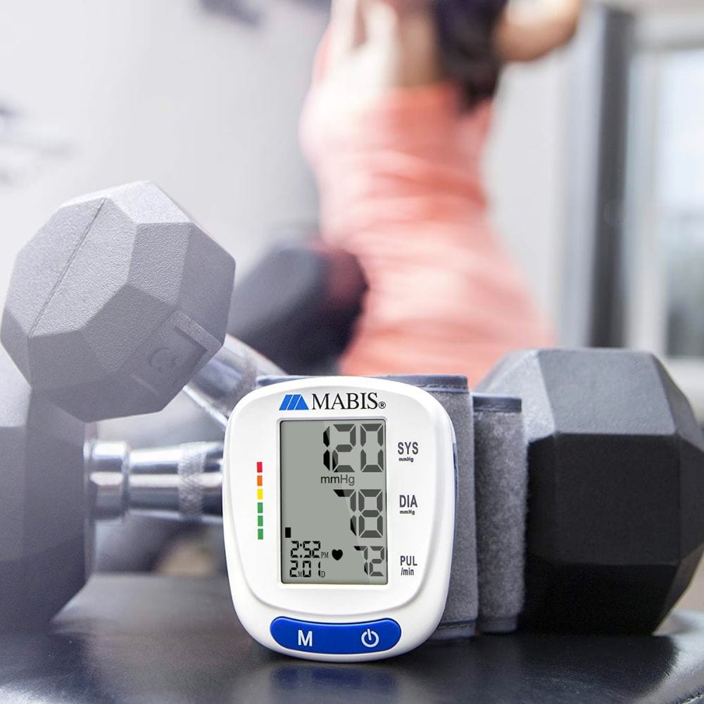 Mabis blood pressure monitor with dumbbells in a gym setting