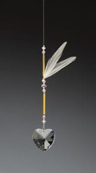 Decorative hanging ornament with feather and crystal heart on a gray background