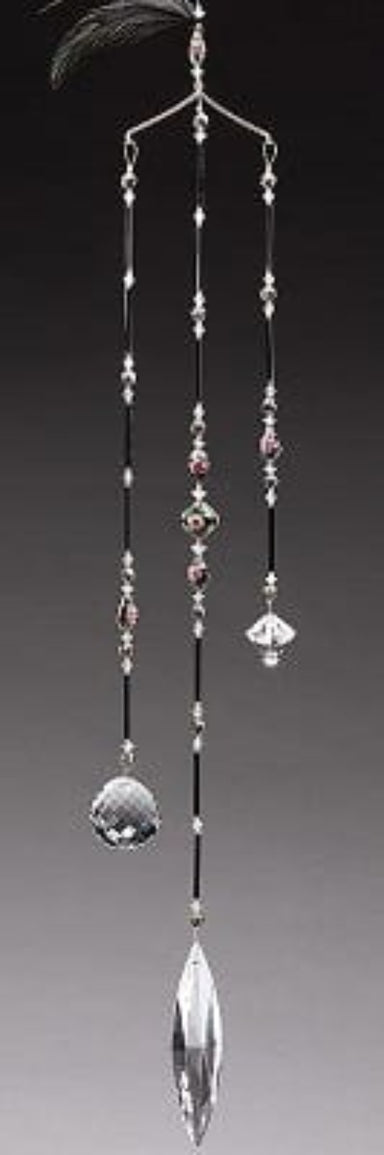 Decorative hanging crystal with beads on a gray background