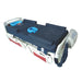 Medical stretcher with blue cover and equipment on a white background