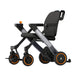Black and gray stroller with orange accents on a white background