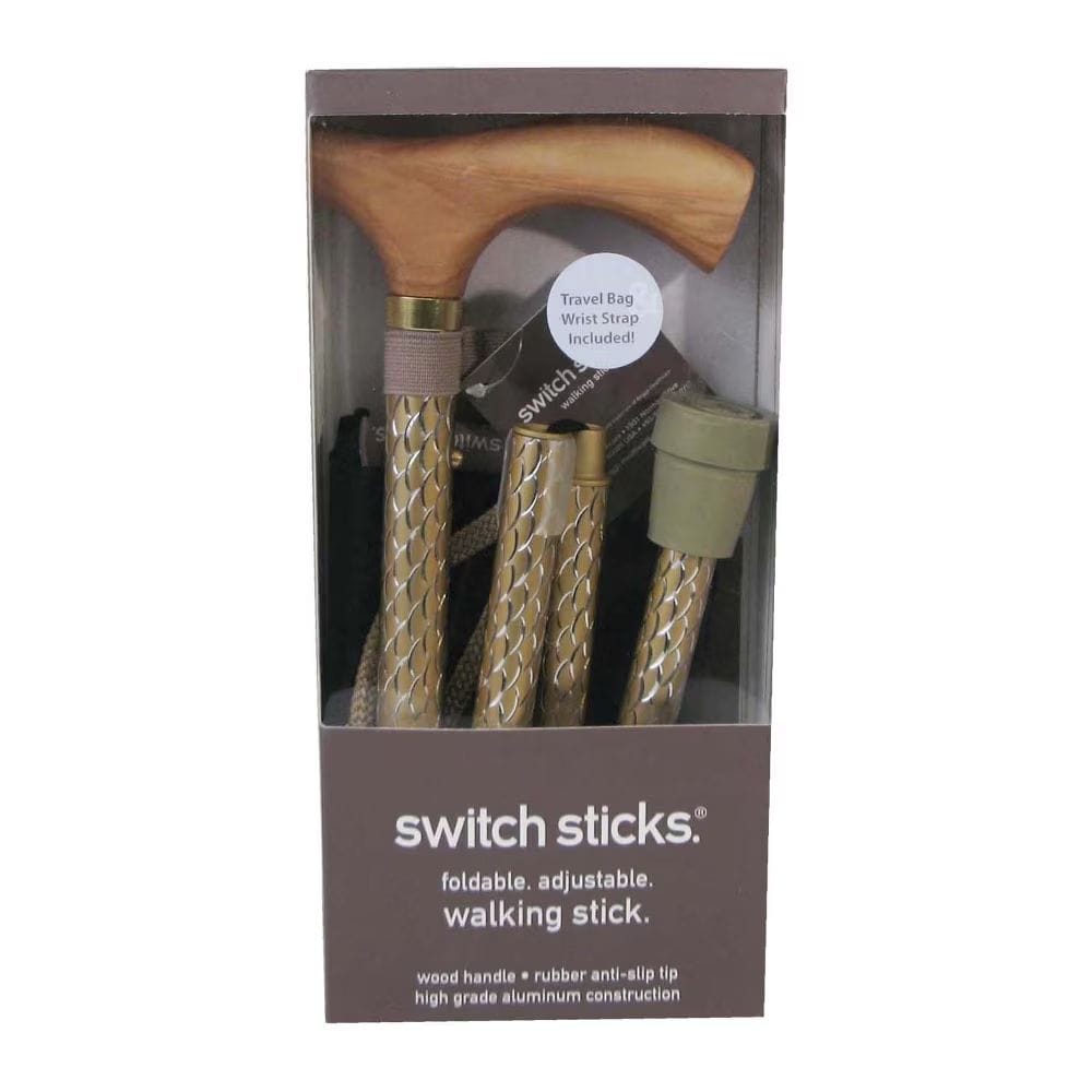 Packaged walking stick with wooden handle and gold accents, featuring 'switch sticks' branding.