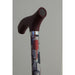 Cane with a patterned handle on a plain background
