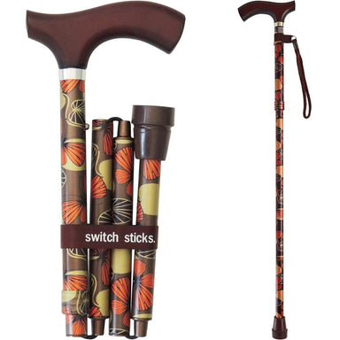 Foldable walking cane with patterned handle and packaging labeled 'switch sticks' on a white background.