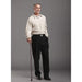 Man holding a cane against a gray background