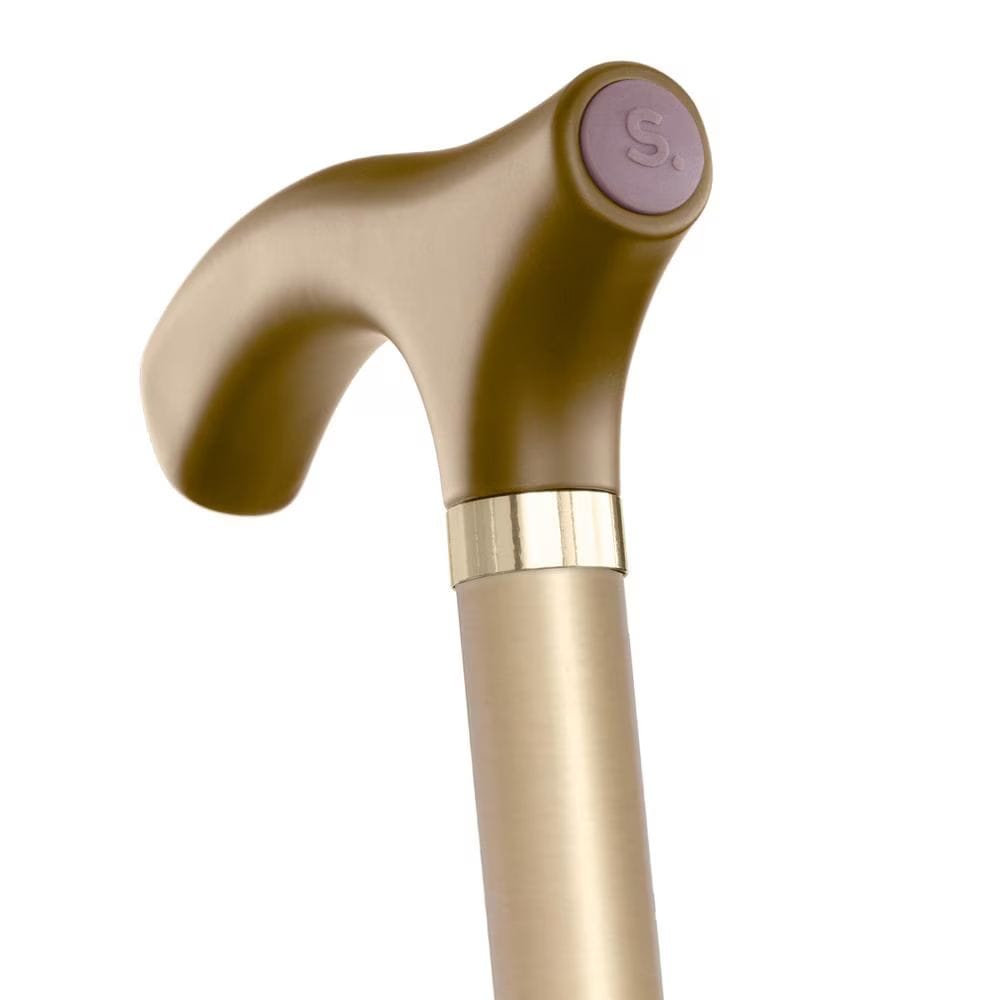 Gold-colored walking cane with a purple handle on a white background
