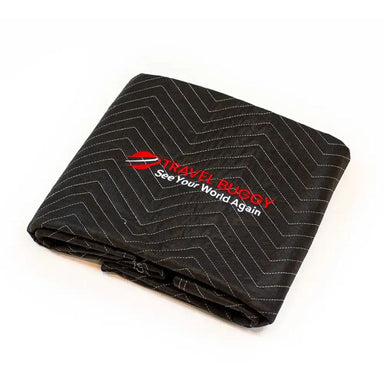Folded black blanket with zigzag pattern and 'Travel Buggy' logo on a white background