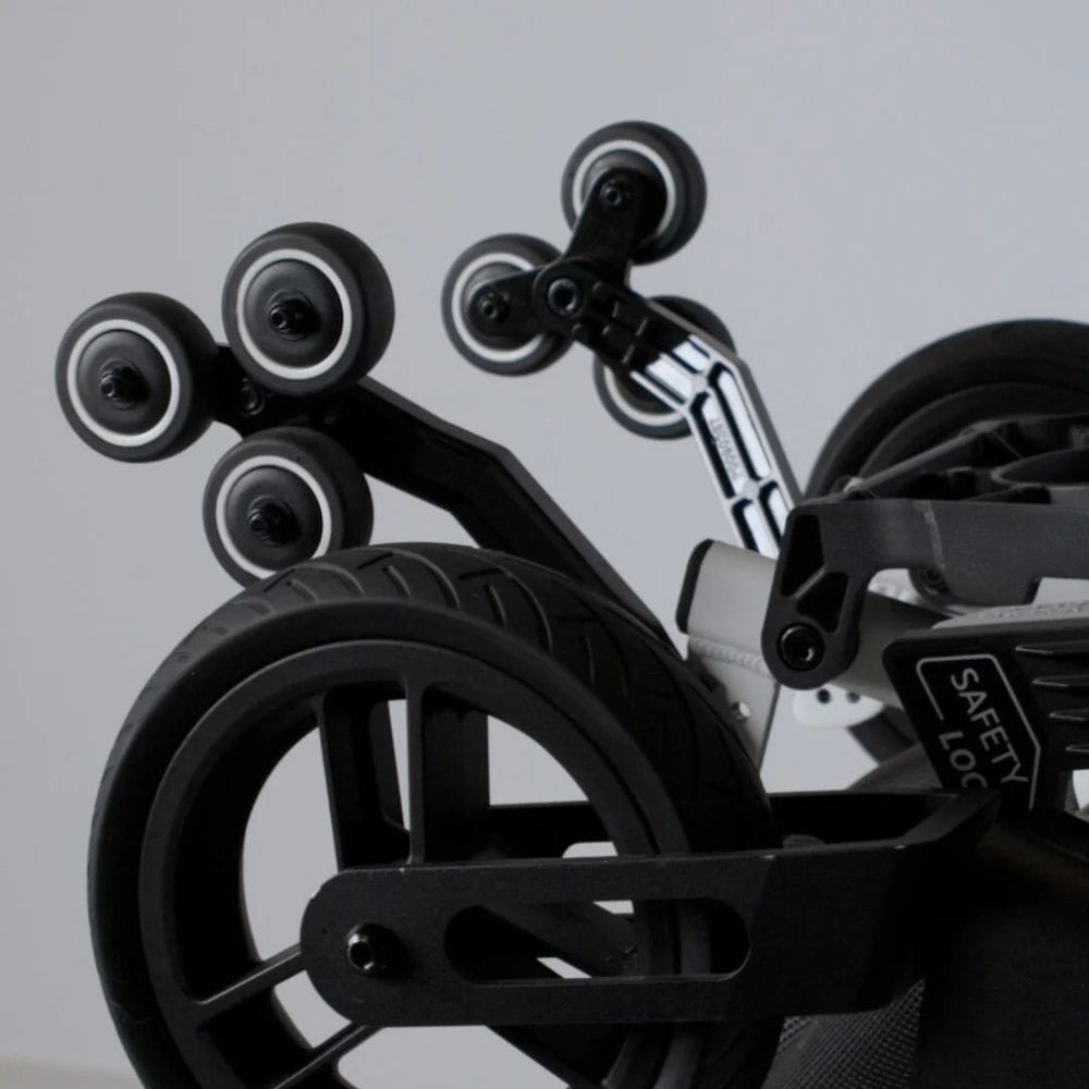 Close-up of a bike's suspension system with a blurred background