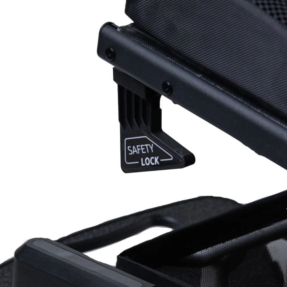 Black safety lock mechanism on a black chair with a white background