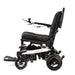 Black and white electric wheelchair on a white background
