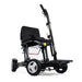 Black electric wheelchair on a white background