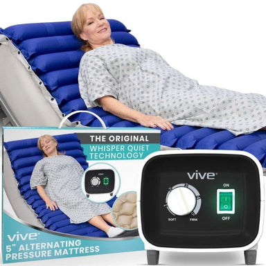 Woman lying on an alternating pressure mattress with Vive branding and control panel.