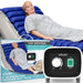 Woman lying on an alternating pressure mattress with Vive branding and control panel.