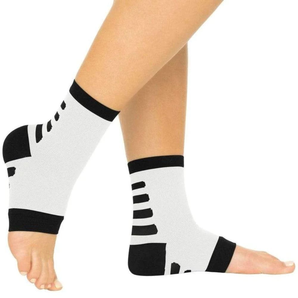 White socks with black stripes worn by a person on a white background