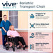 Vive Mobility bariatric transport chair with user and caregiver outdoors.