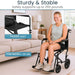 Woman using a black wheelchair in a living room setting with text highlighting features like 'Sturdy & Stable' and 'Padded Seat'.