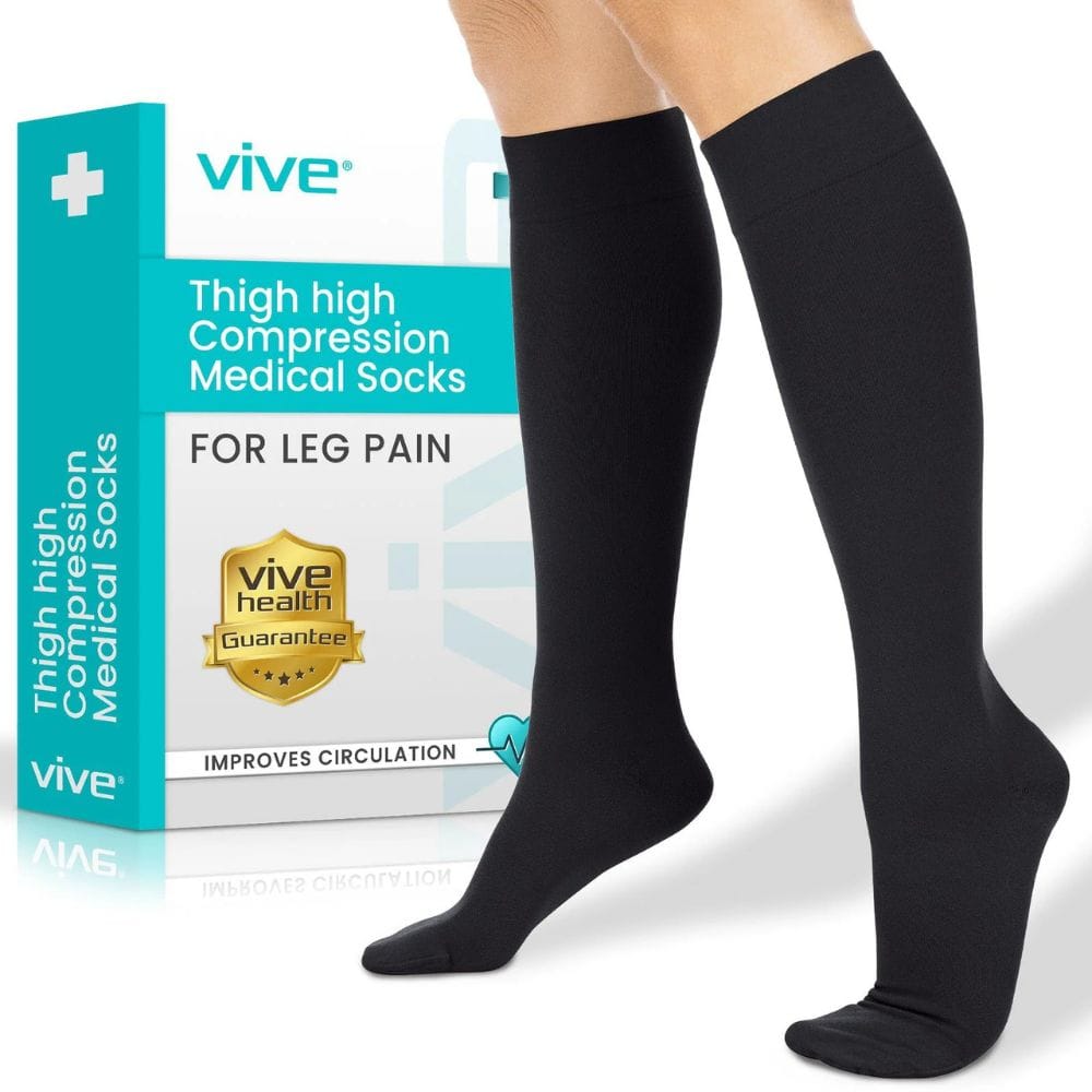 Black thigh-high compression socks with Vive packaging on a white background
