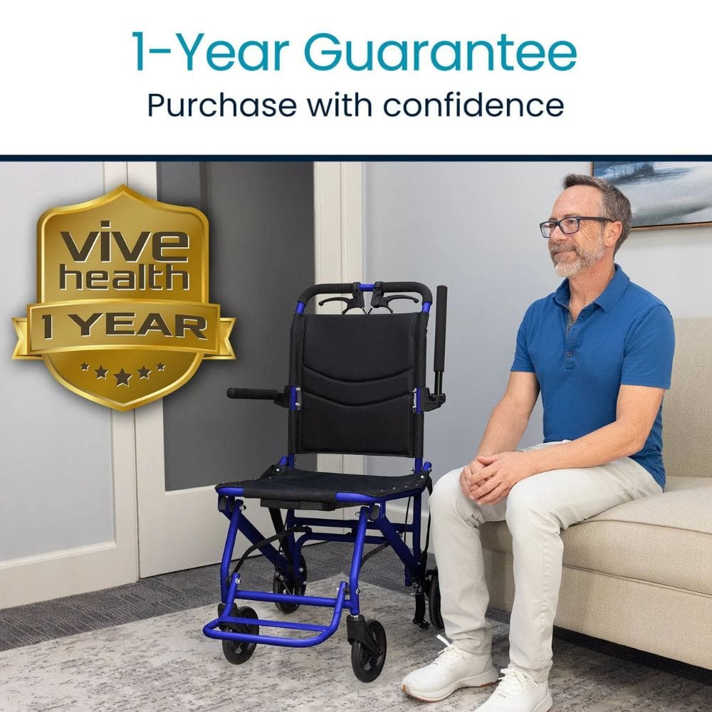 Man sitting on a couch next to a blue and black wheelchair with a 'Vive Health' one-year guarantee badge.
